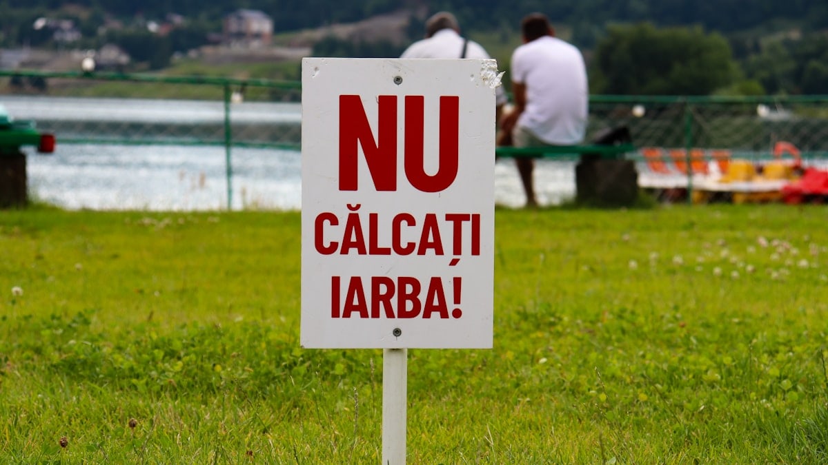 Sign at the Colibita lake, Romania